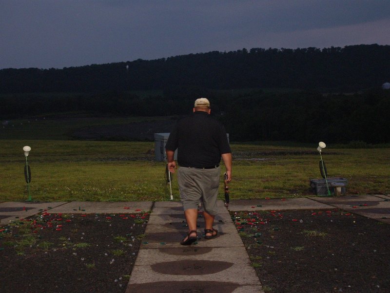 dscf0120s.jpg - Round 10... and they're both still straight... its raining, its dark and both shooters have gone 425 straight on the day.