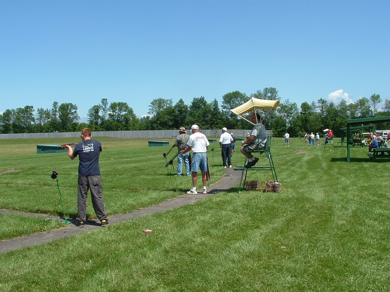 dscf0080b.jpg - Collin Bigras (Junior All American from Vermont on 2), Doug Duncan (NYSATA President on 3), a guy I shoot with from Binghamton (can't remember his name on 4) and Keith Welch (former NYSATA President on 5) shooting in today's handicap event. This shot is of bank 2A looking back toward the practice traps. 